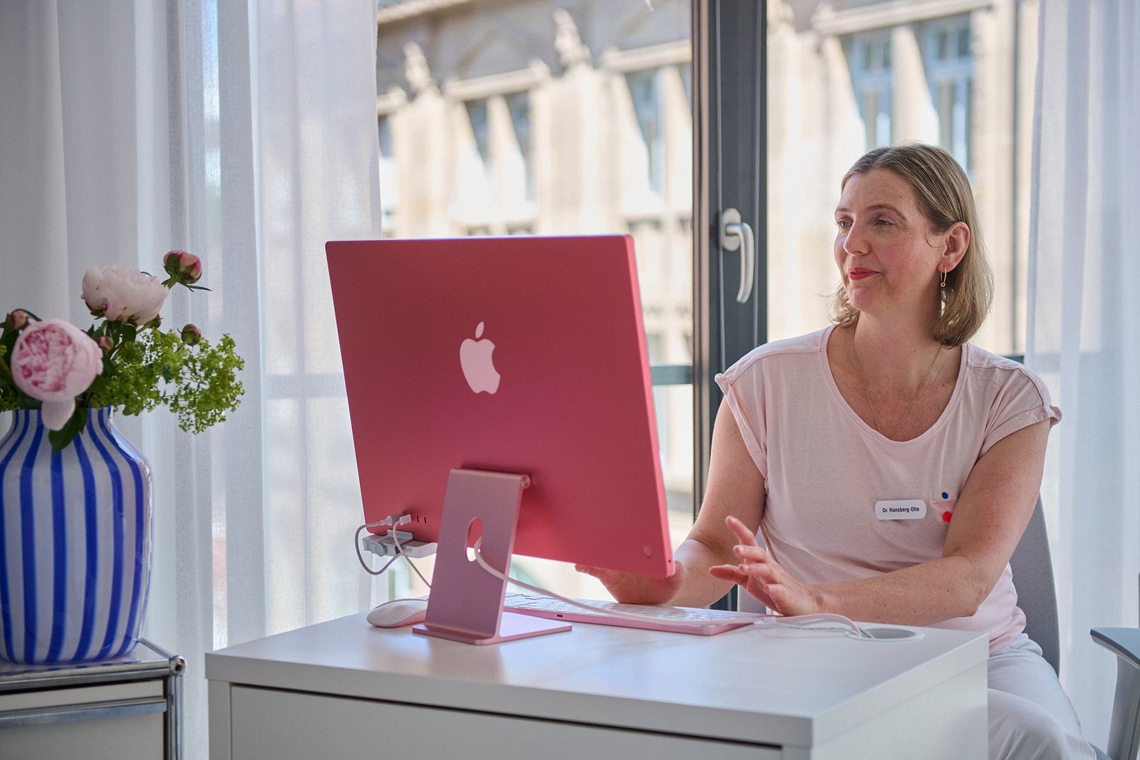 Physician at the iMac in the consulting room